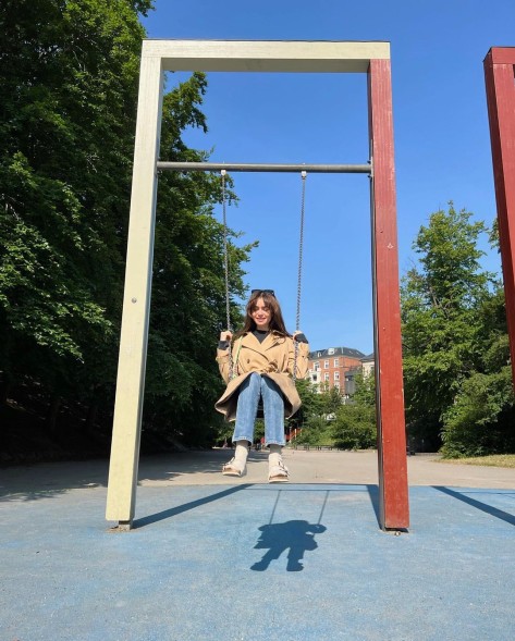 Lily Collins on a swing. 